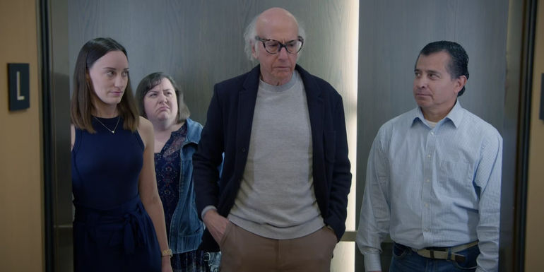 Everyone in an elevator stares at Larry in Curb Your Enthusiasm