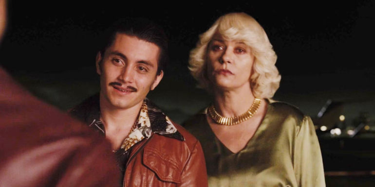 Griselda Blanco standing beside Uber in Cocaine Godmother