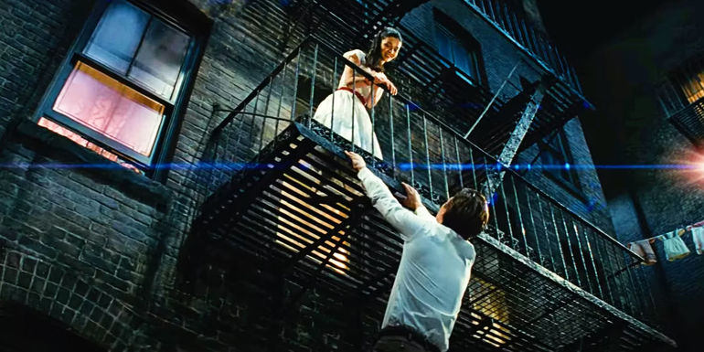 Maria and Tony sing to each other on the fire escape in West Side Story 2021