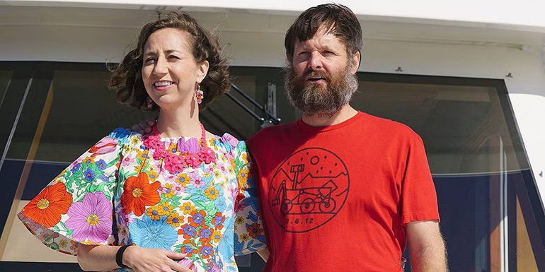 Carol and Phil standing on a boat in The Last Man on Earth