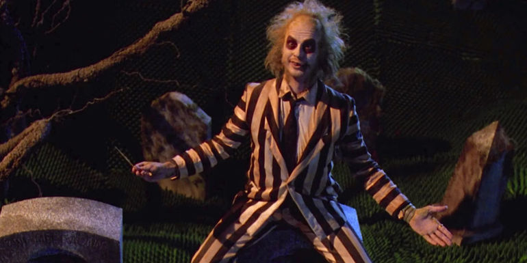 Michael Keaton as Beetlejuice in his iconic striped suit in Beetlejuice