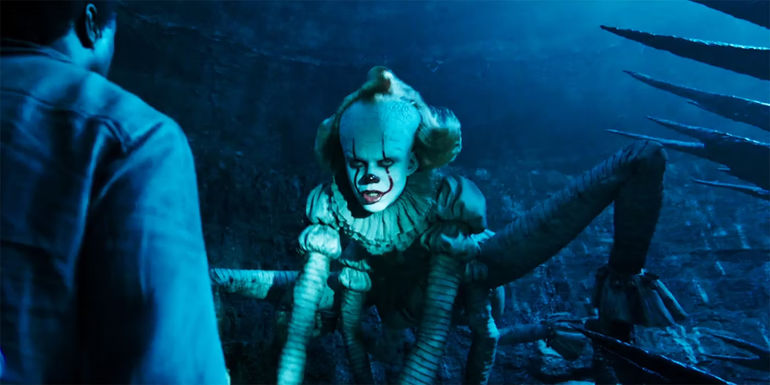 Pennywise in spider form looks at Mike in IT Chapter Two.