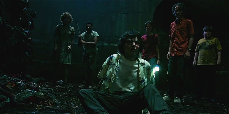 The Losers Club looks terrified in the sewers at the ending of IT