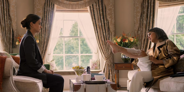 Ana (Camila Mendes) watches Claire (Marisa Tomei) shave her legs in Upgraded