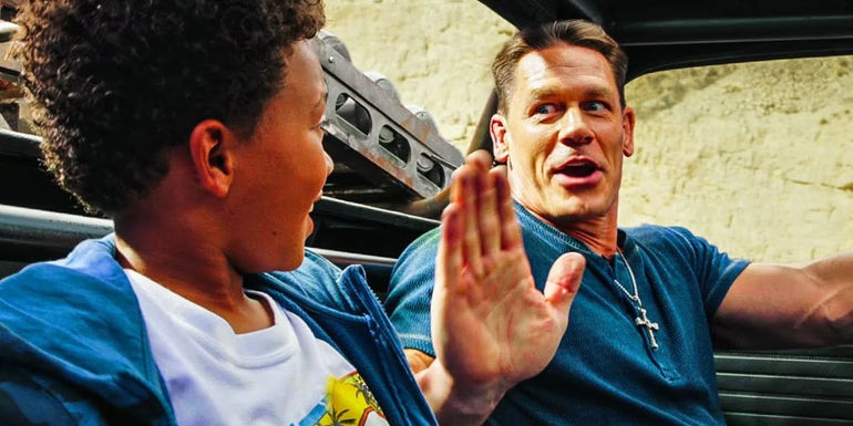 Jakob (John Cena) and little Brian driving in a car in Fast X