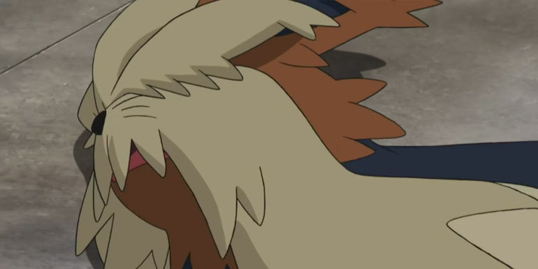 Pokemon: Stoutland lies incapacitated, struggling to breathe.