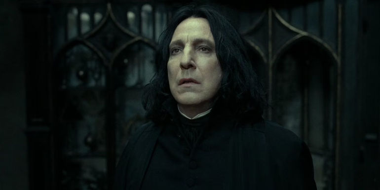 Snape tells Dumbledore he will always love Lily in Harry Potter in front of a dark door in the Harry Potter movies