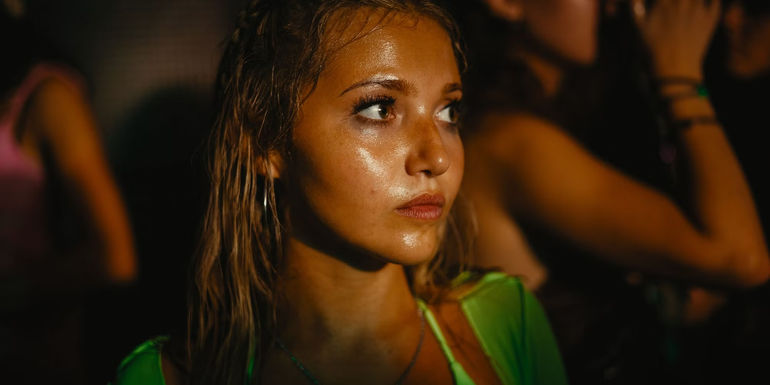 Tara stands in a dance club in How to Have Sex