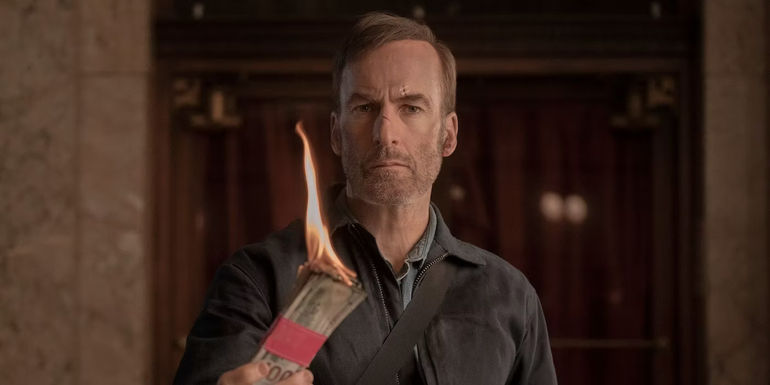 Bob Odenkirk as Hutch in Nobody holding money on fire