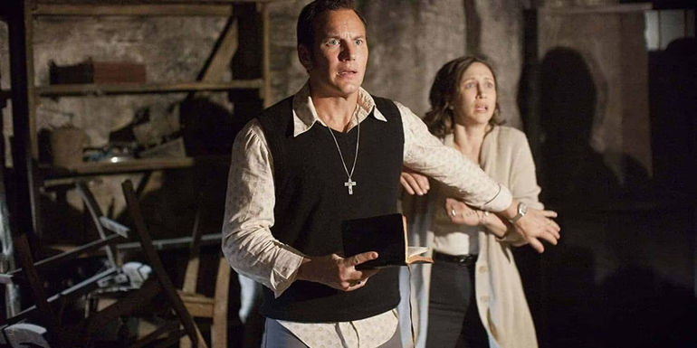 Ed Warren holding back Lorraine in The Conjuring