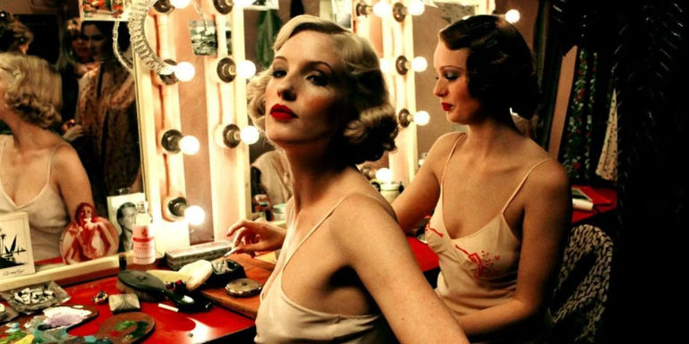 Kelly Reilly looking sideways in a vanity room in Mrs Henderson Presents 