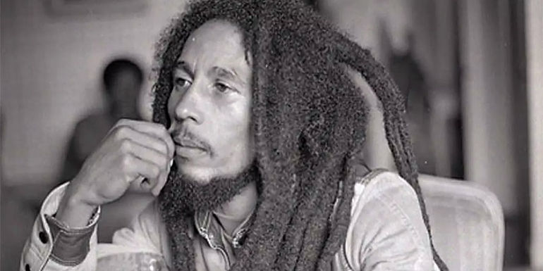 Bob Marley sitting with his hand to his face in the Who Shot the Sherif? documentary.