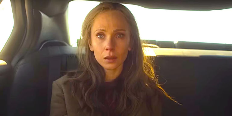Juno Temple as Dot sitting in the back of a car looking shocked in a dramatic scene fromFargo season 5