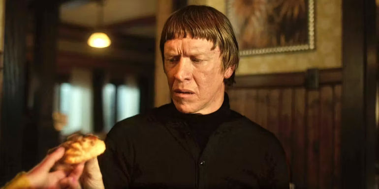 Ole Munch looking at the biscuit in Fargo season 5