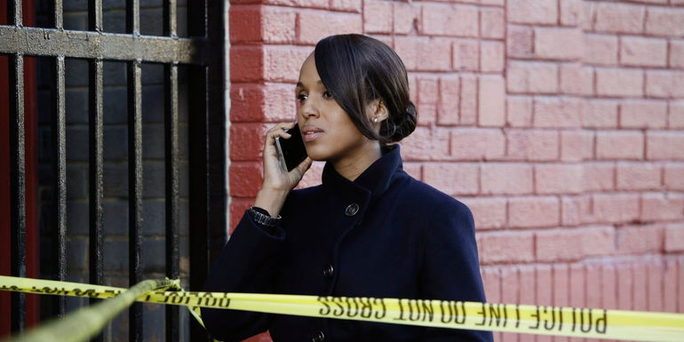 Olivia Pope (Kerry Washington) talking to someone on the phone near a crime scene in Scandal