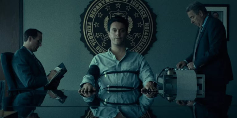 A man taking a lie detector test in Above Suspicion