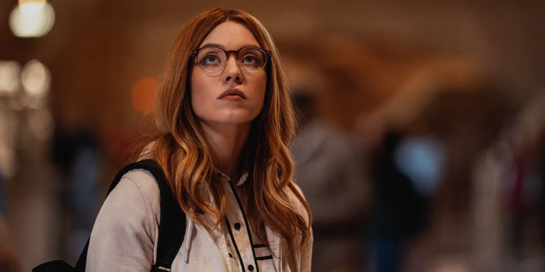 Julia looks ahead wearing glasses in Madame Web