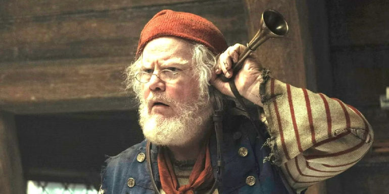 Mr. Smee (Jim Gaffigan) holding a trumpet to his ear in Peter Pan and Wendy.