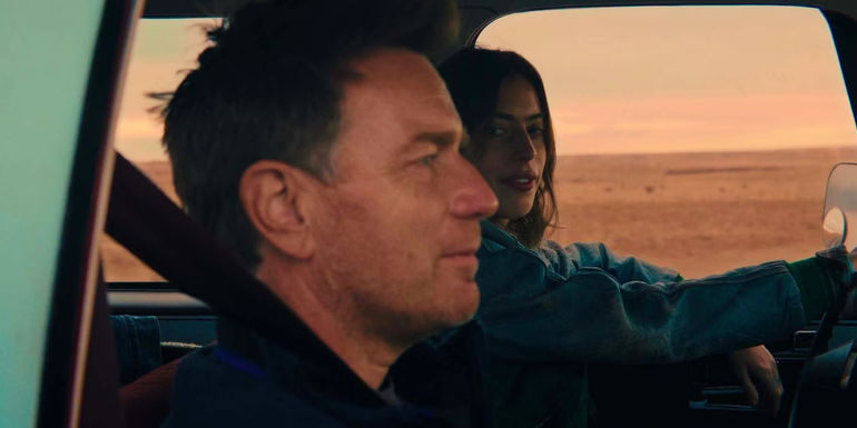 Ewan McGregor in profile as Clara McGregor looks at him from across the car in Bleeding Love
