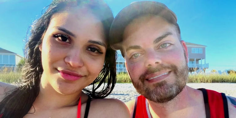 90 Day Fiancé star Tim Malcolm and girlfriend Linda Ramirez smiling in the sun