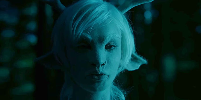 A Fillory creature has a woman's face with white hair, doe ears and antlers in The Magicians.