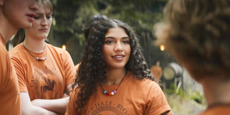 Clarisse smiling among her posse in Percy Jackson and the Olympians