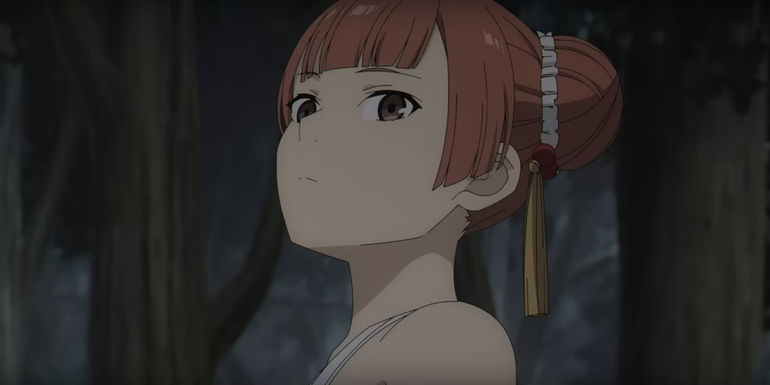 Laufen from Frieren making a serious expression while in the woods.