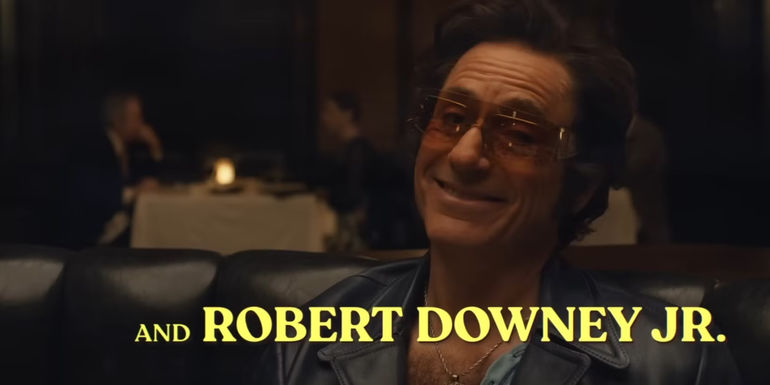 Robert Downey Jr. in a disguise with his name written on screen in The Sympathizer trailer