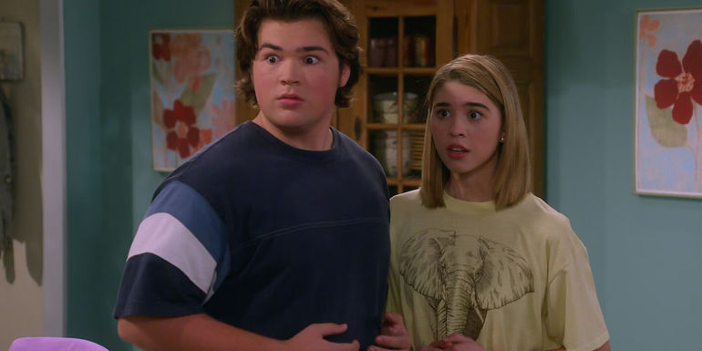 Leia (Callie Haverda) and Nate (Maxwell Acee Donovan) look alarmed in the Formans' kitchen in That '90s Show.