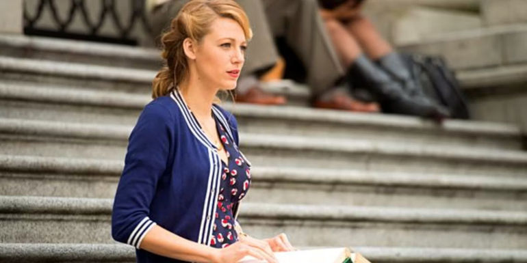 Adaline (Blake Lively) sits on a staircase The Age of Adaline