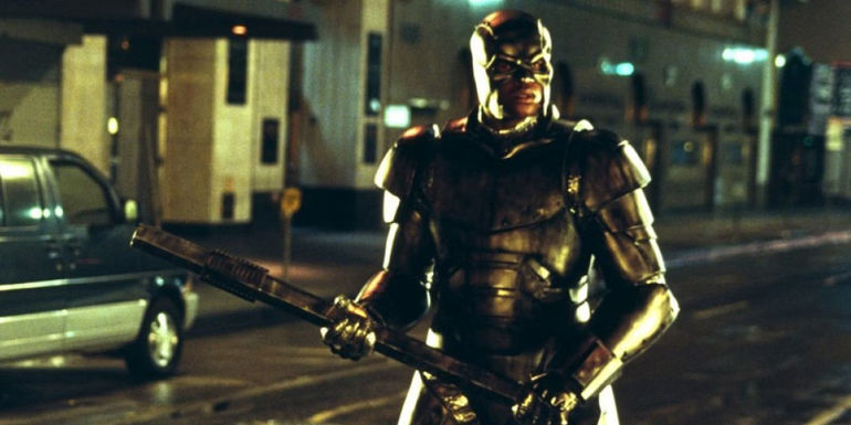 Shaquille O'Neal holding an iron rod in costume in Steel