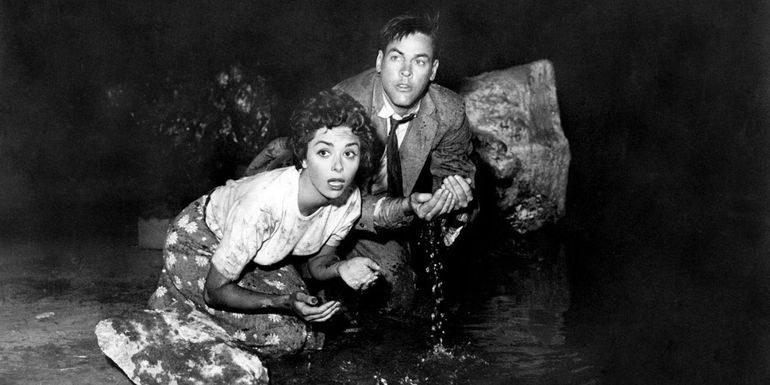 Elizabeth and Matthew cowering in Invasion Of The Body Snatchers