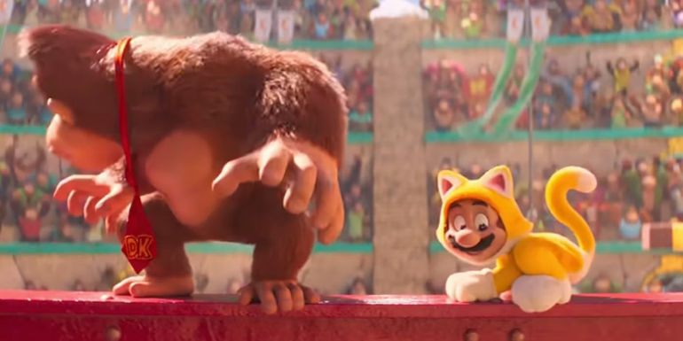 Mario perched on a railing and Donkey Kong looking around in The Super Mario Bros. Movie.