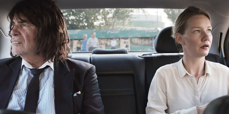 Winifried and Ines sit in a car in Toni Erdmann