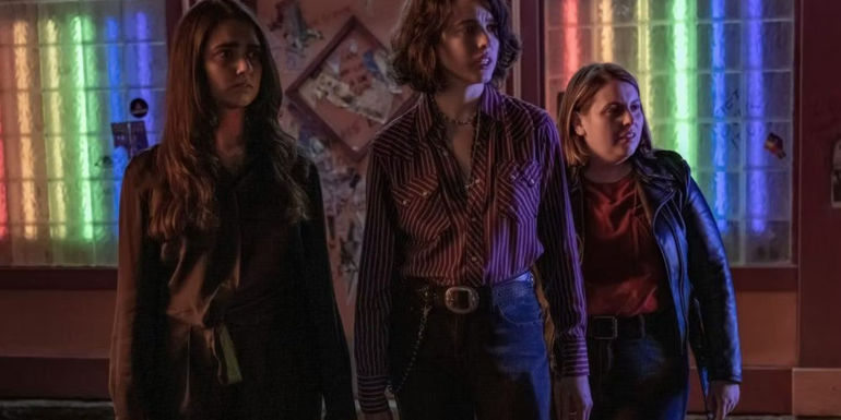 Jamie, Marian and Suki looking sideways in Drive-Away Dolls