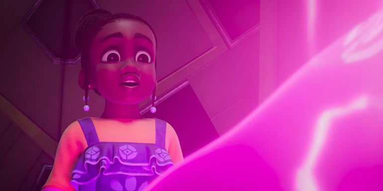 Simisola Gbadamosi as Tola looks in wonder at a glowing pink being in Disney's Iwáju.