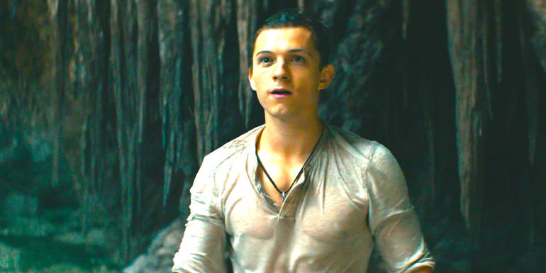 Tom Holland soaking wet in a dank cave in Uncharted