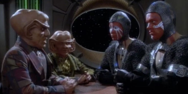 Quark and Pel negotiate with the Dosi in Star Trek: Deep Space Nine