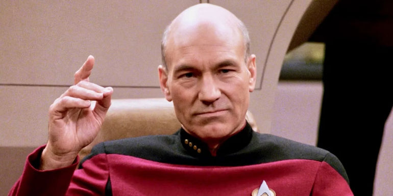 Captain Picard with his finger pointing in the air in Star Trek TNG