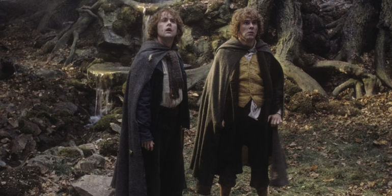 Merry and Pippin stand in Fangorn Forest in Lord of the Rings: The Two Towers