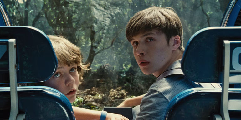 Ty Simpkins and Nick Robinson looking behind them in Jurassic World - The T. Rex - Jurassic World (2015)