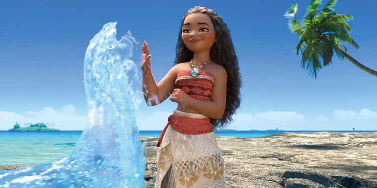 Moana playing with water in the ocean in Moana