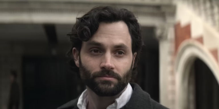 Joe standing next to a building in You