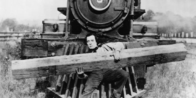 Buster Keaton on the front of a train in The General - Buster Keaton’s Physical Acting Genius Explained