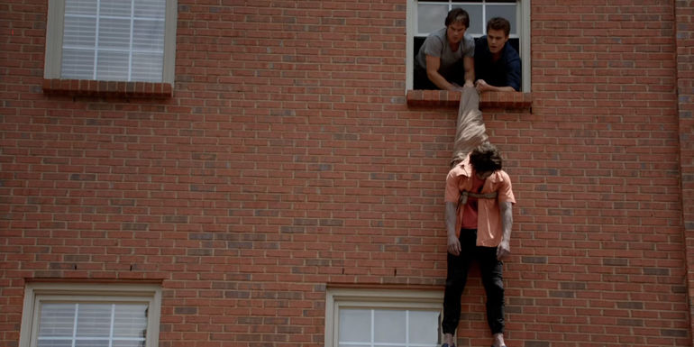 Stefan and Damon hang a body in The Vampire Diaries.