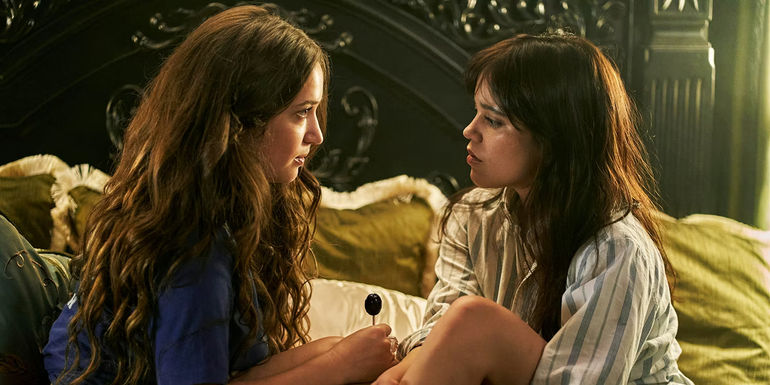 Cairo and her friend talking on the bed in Miller's Girl