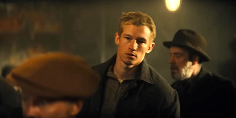 Callum Turner as Joe Rantz in The Boys in the Boat.