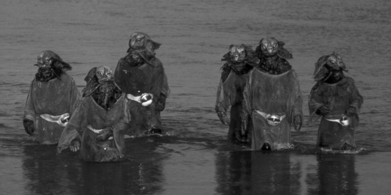 Sea Devils standing in the water in an older episode of Doctor Who
