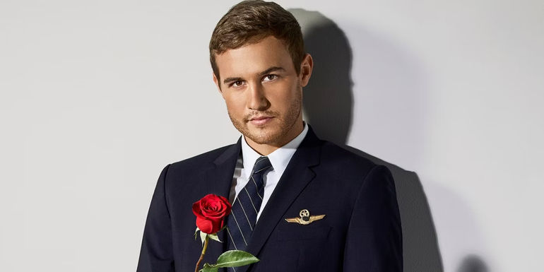 The Bachelor's Peter Weber Holding a Rose Promo Photo
