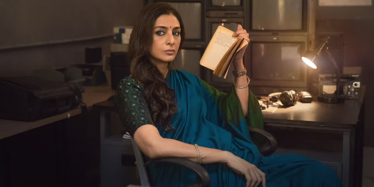 Krishna Mehra sitting with a book in Khufiya